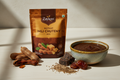 A close-up of Zaykoo Instant Imli Chutney Mix packet beside a bowl of tamarind chutney. Ingredients like tamarind pods, jaggery, dates, and cumin seeds arranged around it. Clean white or wooden background, professional packaging focus, soft shadow, and high contrast.