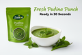 Zaykoo Pudina Chutney packet and a bowl of bright green chutney in the center. Fresh mint leaves and green chili arranged around. Text overlay: “Fresh Pudina Punch. Ready in 30 Seconds.” Clean and vibrant aesthetic.